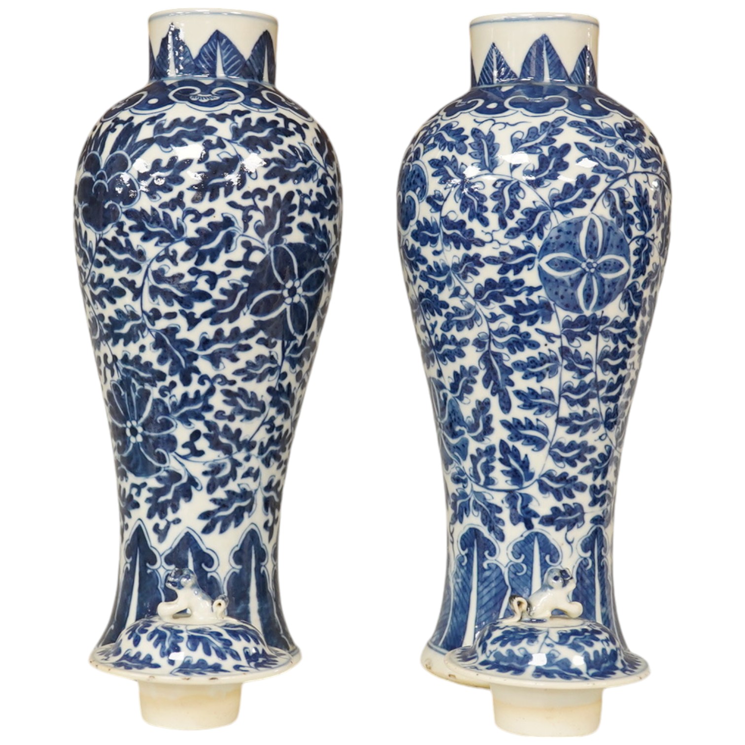 A pair of Chinese blue and white lotus decorated baluster vases and covers, late 19th century